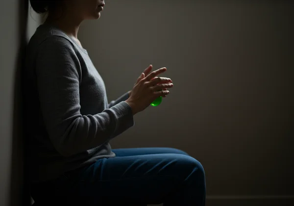 Person using calming stimming technique in quiet space